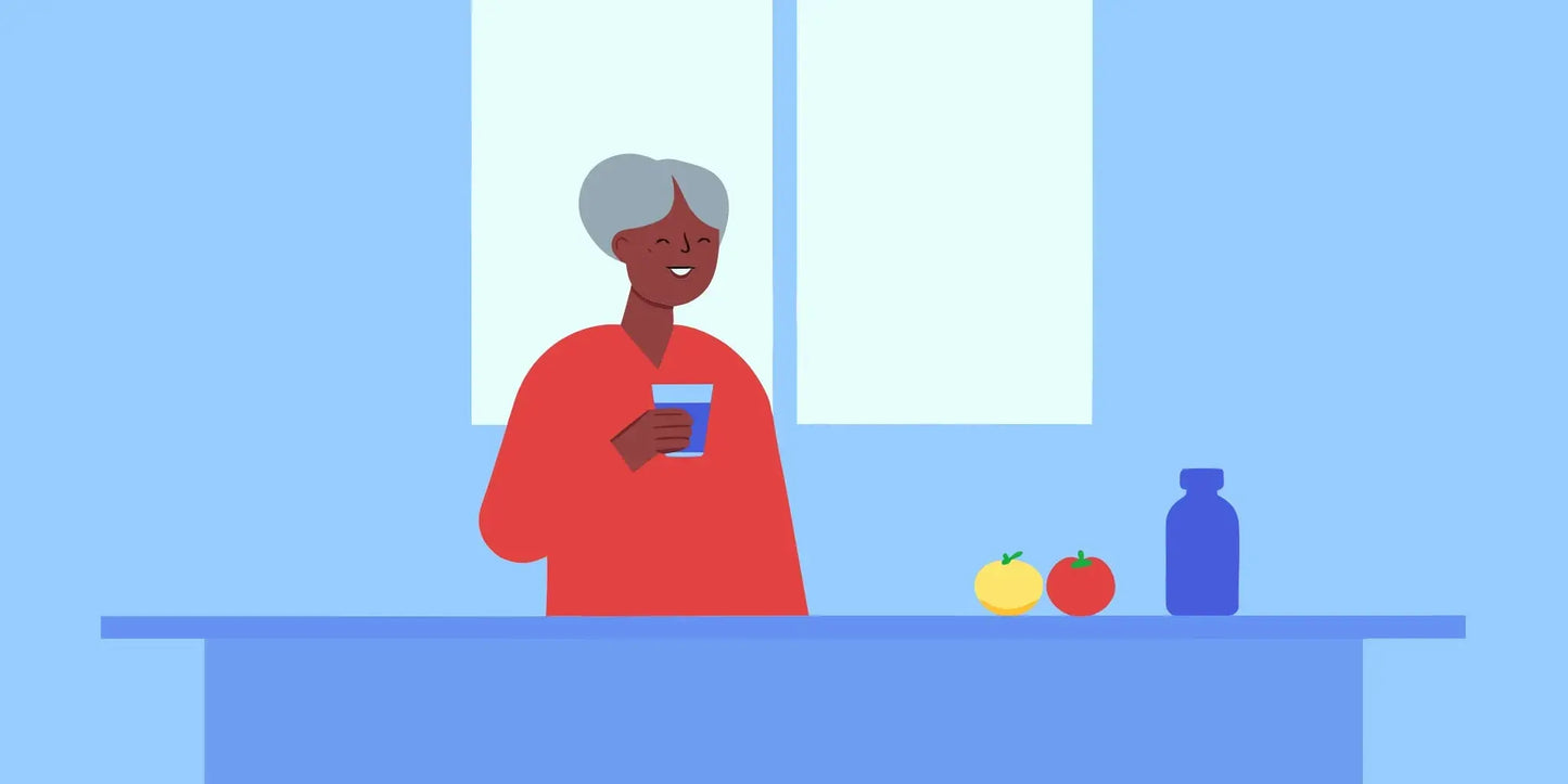Older woman with healthy, glowing skin holding a glass of water in a sunlit kitchen, supplement bottle on counter