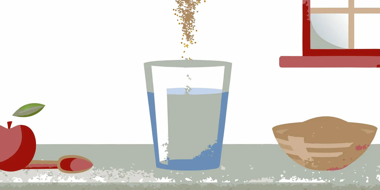 Mixing the best fiber supplement in a glass of water for regular bowel movements.